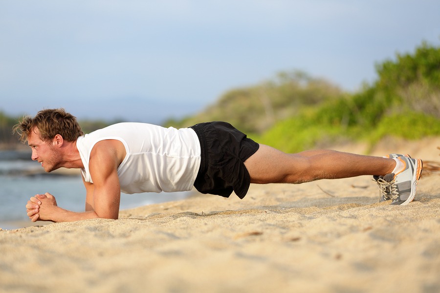 Crossfit training fitness man doing plank core exercise working