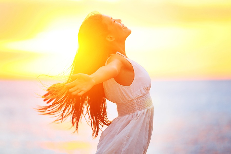 Enjoyment - free happy woman enjoying sunset. Beautiful woman in